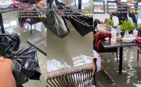 Customers lift their legs while dining as flood water takes over restaurant in Lagos (video)